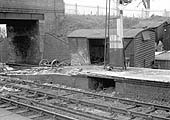 A wrecked four-wheel Vent Van, minus both axles, is seen in the bay of Hatton station on 27th April 1963