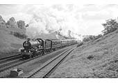 British Railways 4-6-0 4073 �Castle� class No 4082 'Windsor Castle' is seen climbing Hatton Bank on the down main line with the Royal Train on 24th May 1962