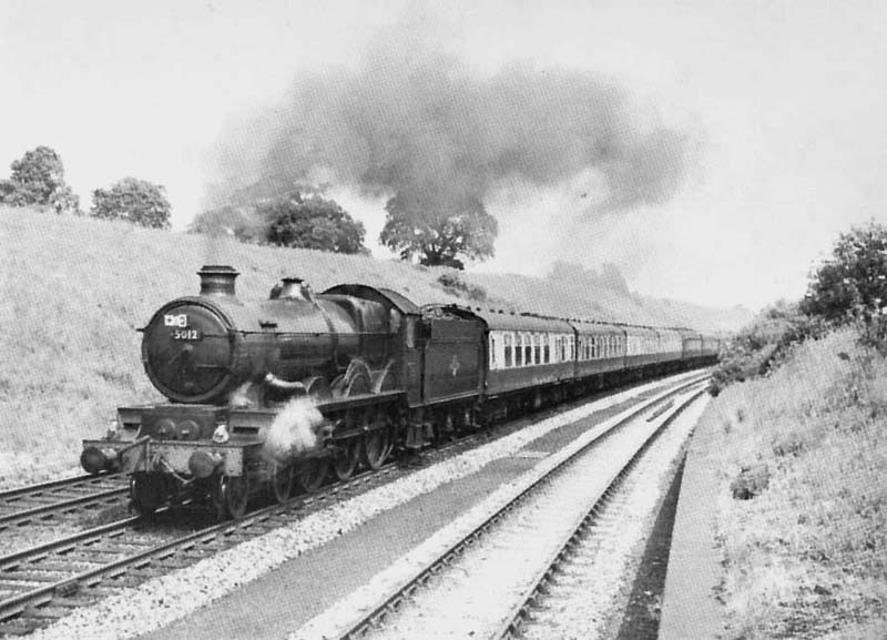 Ex-Great Western Railway 4-6-0 4073 Castle class No 5012 Berry Pomeroy Castle ascends Hatton Bank on the up main line with an express