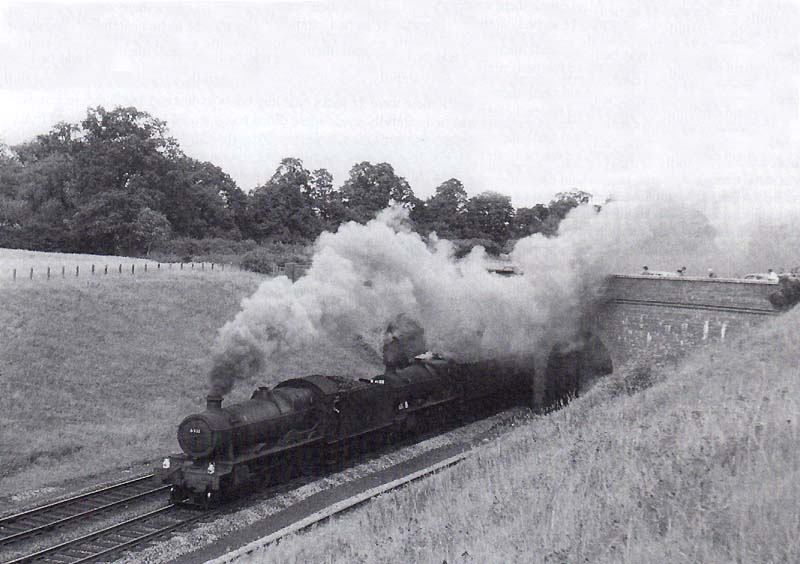 Ex-GWR Hall Class 4-6-0 No 6911 'Holker Hall' pilots an unknown ex-GWR 2-6-0 Mogul locomotive