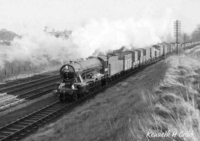 Ex-WD 'Austerity' 2-8-0 No 90589 is seen at the head of a down freight train on 1st December 1951