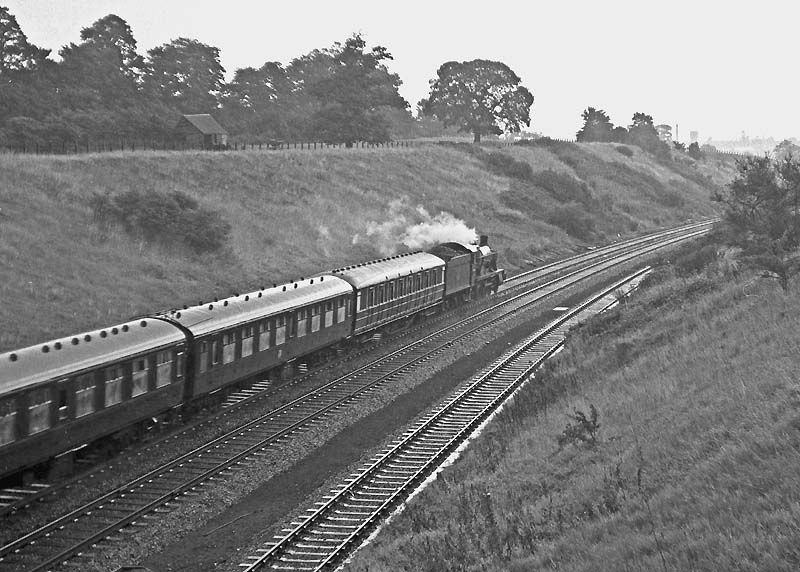 British Railways built 6959 Class 4-6-0 No 6991 'Acton Burnell Hall' descends Hatton Bank with the 09:05 Birkenhead to Poole service on 8th August 1964