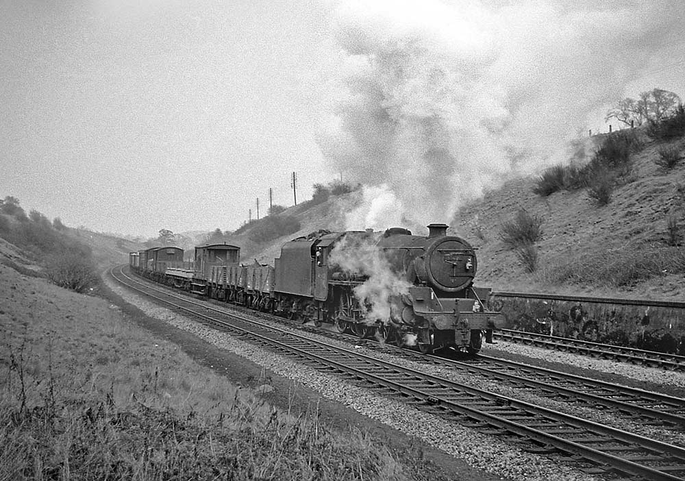 Ex-LMS 4-6-0 Class 5 No 45188 battles up Hatton bank with a heavy northbound freight service on 22nd April 1965