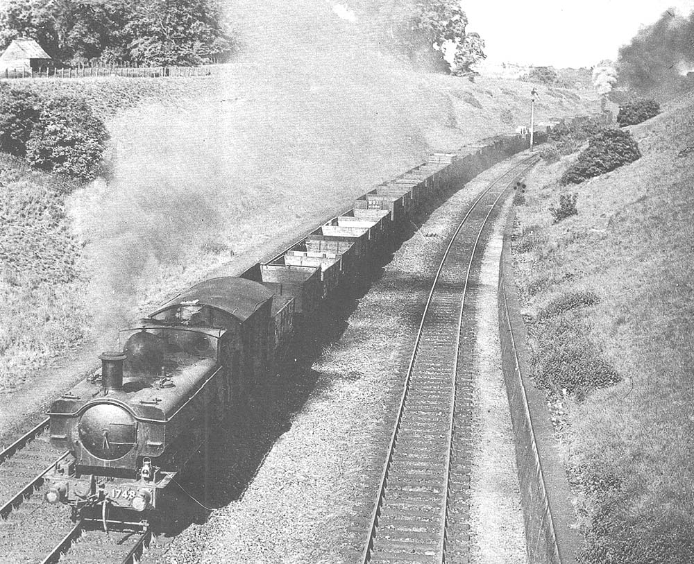 Ex-LMS 4-6-0 Class 5 No 45188 battles up Hatton bank with a heavy northbound freight service on 22nd April 1965