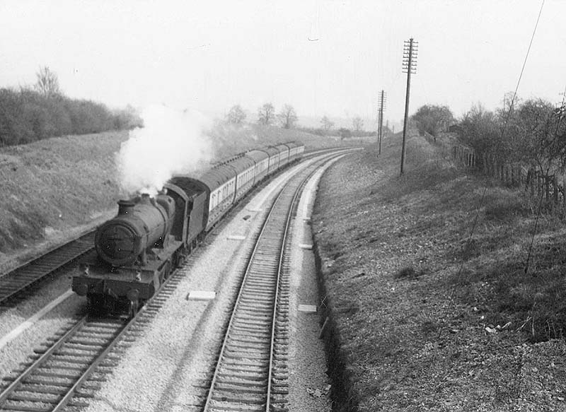 Ex-GWR 4-6-0 49xx 'Hall' class No. 4902 'Aldenham Hall' on a seven coach express climbing the down main at Hatton bank