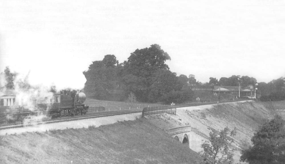 An unidentified GWR 4-4-0 Atbara class locomotive is seen approaching Henley-in-Arden on an up West of England express service in 1912