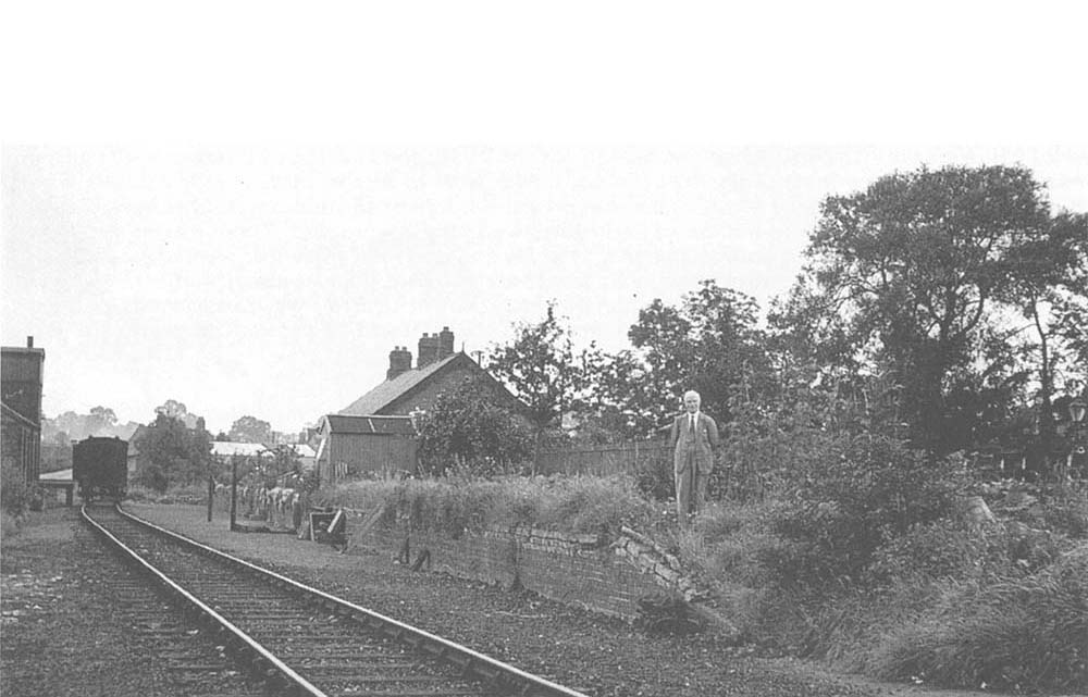 A general view of Henley-in-Arden's original passenger station showing TR Perkins standing on the derelict platform in August 1939