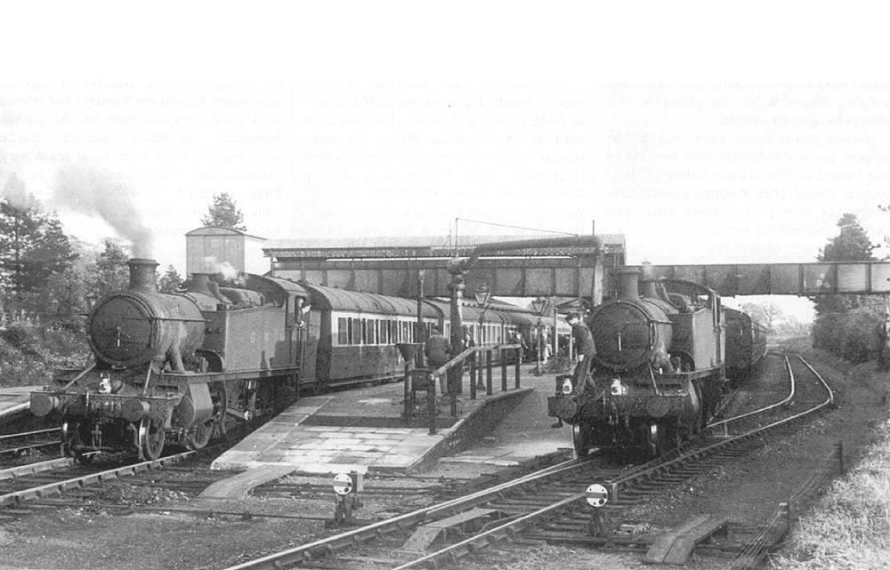 View of two unidentified GWR 2-6-2T 41xx class tank engines are seen standing at Henley-in-Arden two up platforms