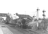 Ex-Railway Operating Department 2-8-0 No 3044 is seen passing through the station whilst at the head of a northbound freight