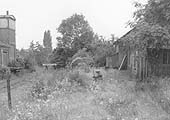 View looking along the platform of Henley-in-Arden's original station showing much neglect and over growth since the 1940s views