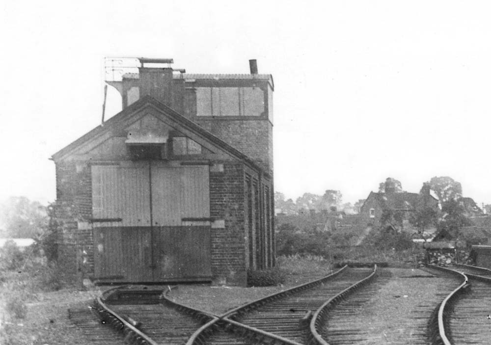 Close up of the shed showing the ventilation provided in the glazed section above the door and single road complete with inspection pit