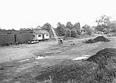 View of Henley-in-Arden's now abandoned goods yard showing the timber storage sheds to the right of the white timber structure