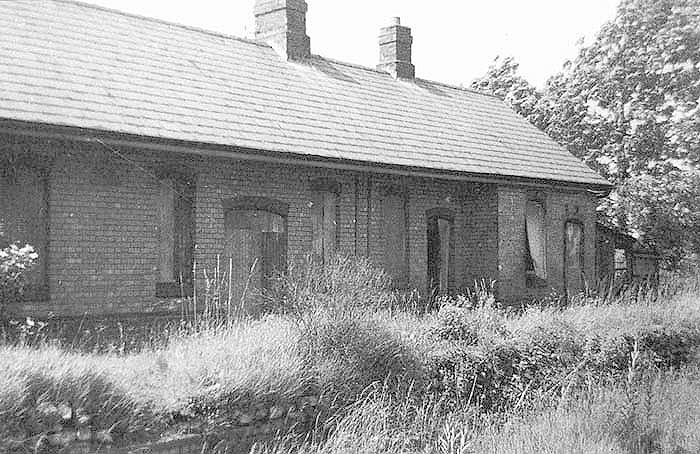View of the front elevation of the original Henley-in-Arden station building and platform which are now seen in a derelict condition