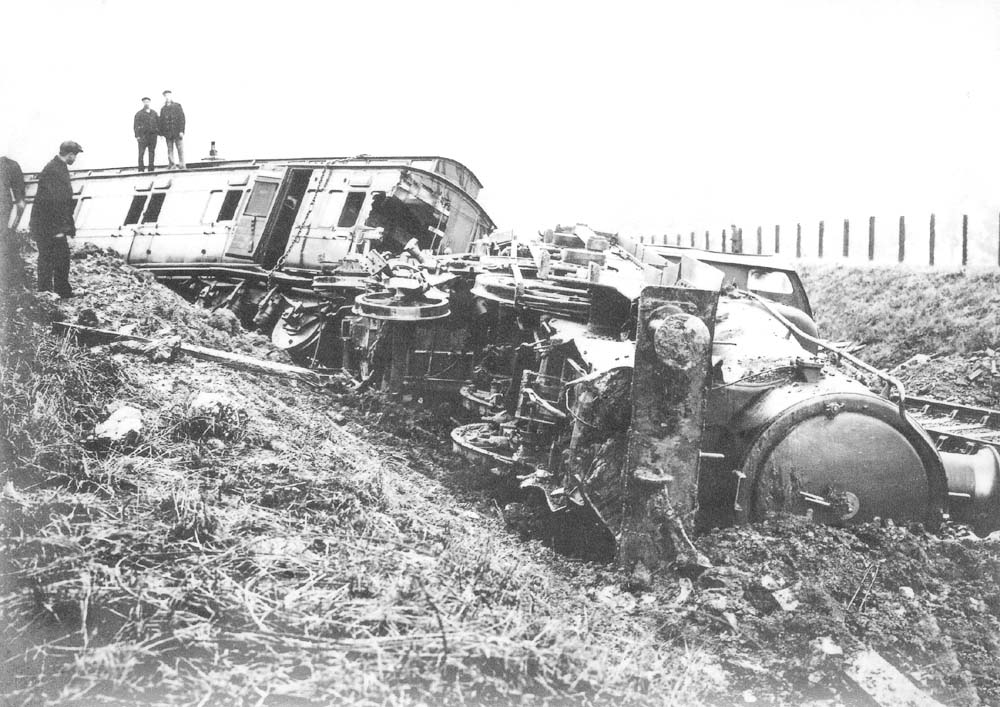 View of GWR 4-4-0 Atbara class No 3382 'Mafeking' lying severly damaged on its side after the accident at Henley-in-Arden