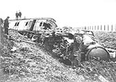 View of GWR 4-4-0 Atbara class No 3382 'Mafeking' lying severly damaged on its side after the accident at Henley-in-Arden