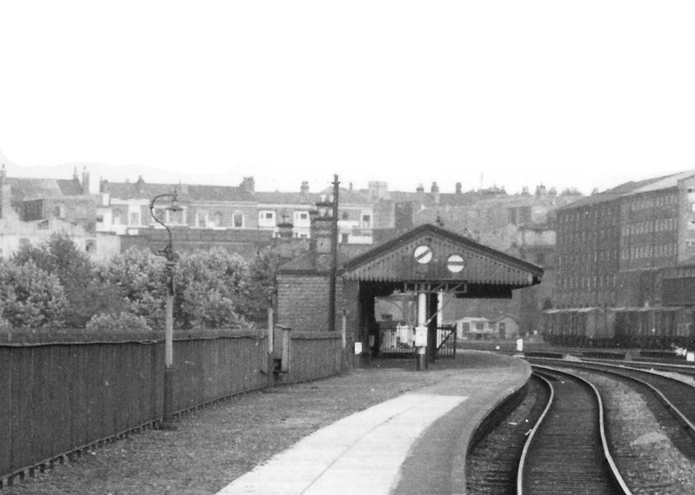 Close up showing the passenger buildings on the up platform and the large disc signals provided in lieu of semaphore arms