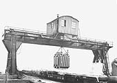 The 25 ton Goliath travelling gantry crane at Hockley Goods Yard unloading a transformer from bogie boiler trolley