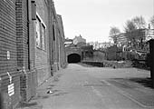 View from ground level of the tunnel which led under the railway to the passenger station circa 1971