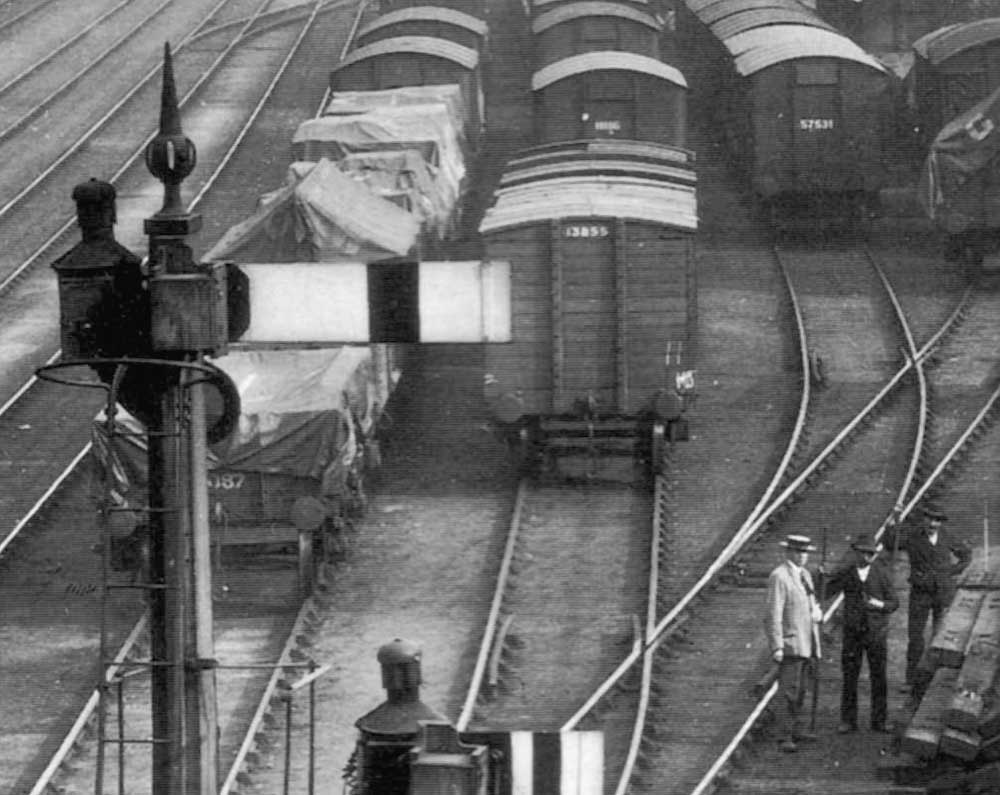 Close up showing mainly GWR box vans being assembled on the roads adjacent to the 'goods outwards' shed