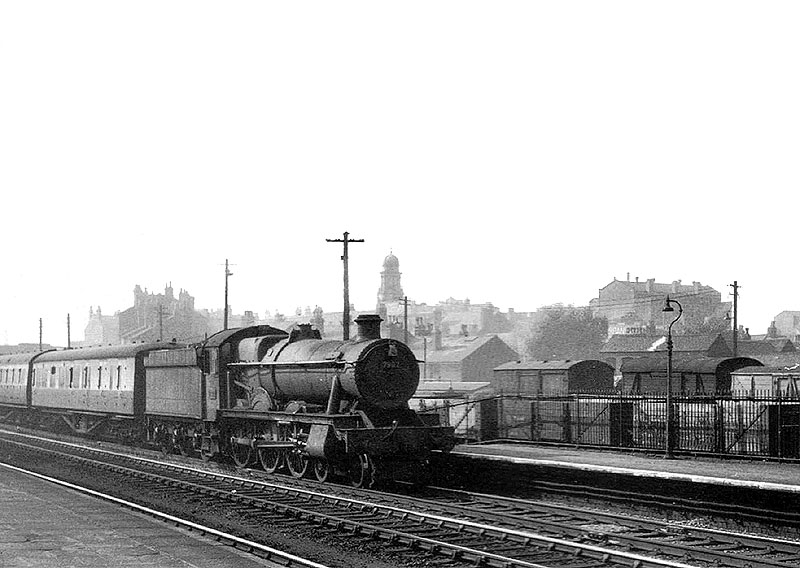 British Railways built 4-6-0 No 7902 'Eaton Mascot Hall' heads an express service through Hockley passenger station in the mid-1950s