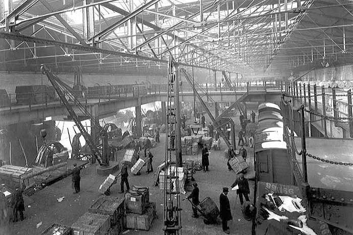An internal view of one of the platforms showing a cartage area with fixed cranes on both sides of the deck