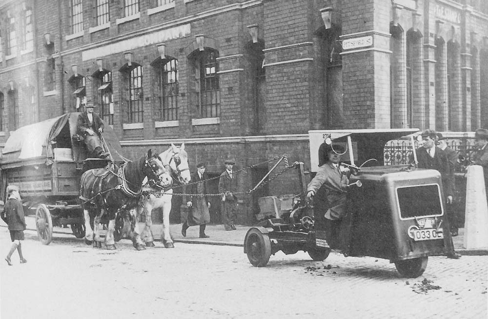 A Great Western Railway Karrier Cob Mechanical Horse acting as the 'Chain Horse' in Pitsford Street with a two horse tilt van