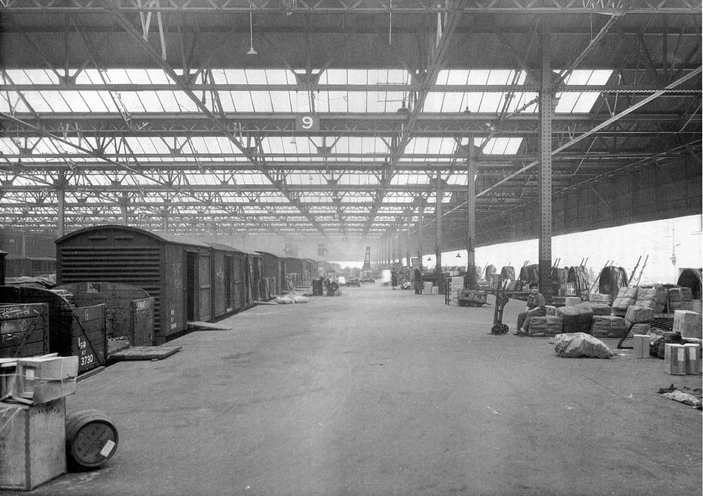 Looking south along the deck of Platforms 2 and 1 under Top shed's glazed roof on 11th August 1943