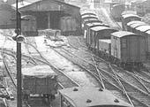 Close up showing the Outwards and Tranship shed's annex and the mix of box vans and open wagons in the train on the right
