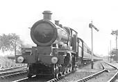 GWR 4-6-0 No 4017 'Knight of Leige' is seen at the head of a Birmingham to Paddington express train as it passes the up loop line near Knowle and Dorridge
