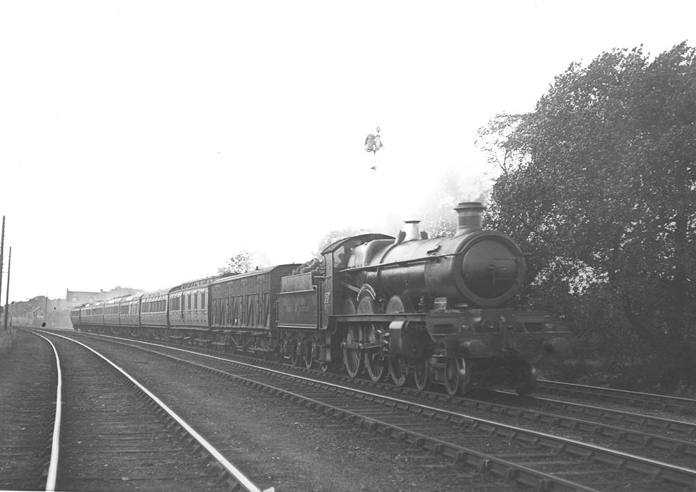 GWR 4-6-0 Star class No 4048 'Princess Victoria' is at the head of express with a Siphon G immediately behind the tender