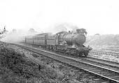 GWR 4-4-0 Bulldog class No 3372 'Sir N Kingscote' on an up excursion train with the  two clerestory coaches behind the tender