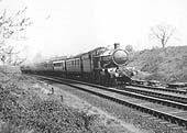 GWR 4-6-0 No 'Dartmouth Castle' is seen at the head of an up express having just left Knowle and Dorridge en-route to Lapworth