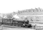 GWR 4-6-0 Hall class No 5990 'Dorford Hall' is seen entering the station at the head of a fast goods service on 22nd April 1958