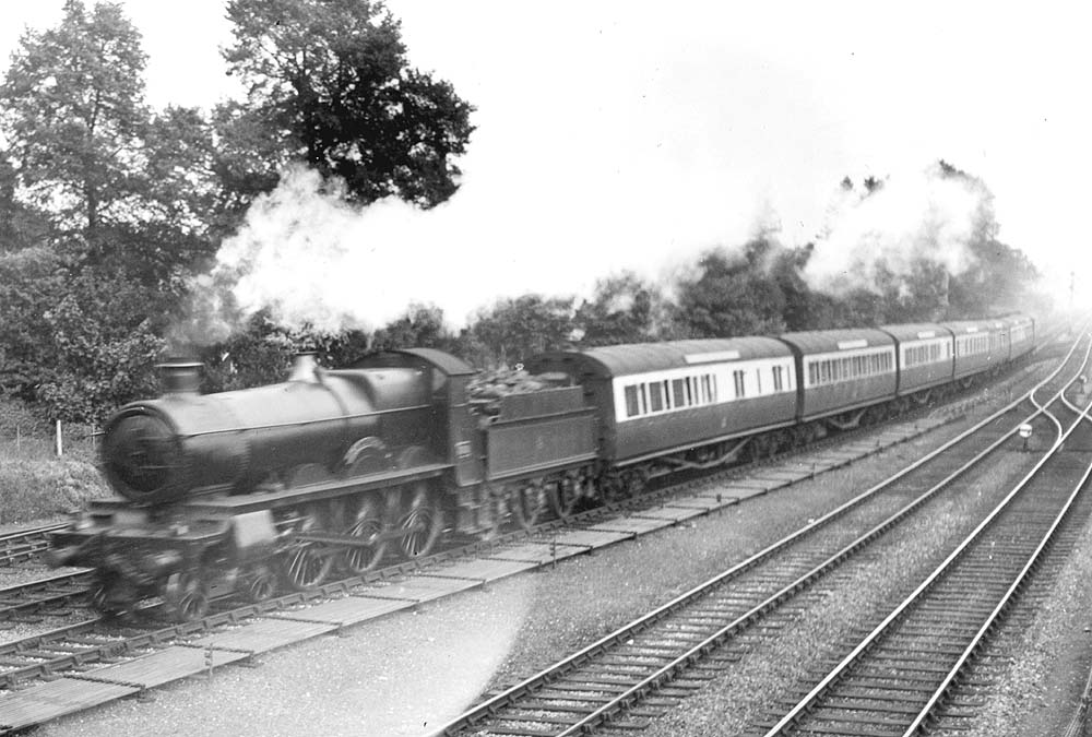 GWR 4-6-0 Saint class No 2989 'Talisman' is seen in full cry on the Down Main at the head of a Paddington to Birkenhead express