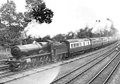 GWR 4-6-0 Saint class No 2989 'Talisman' is seen in full cry on the Down Main at the head of a Birkenhead express