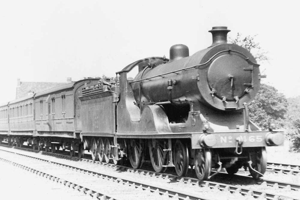 Southern Railways Class D15 No 465 is seen at the head of an up express of Southern coaching stock near Knowle and Dorridge