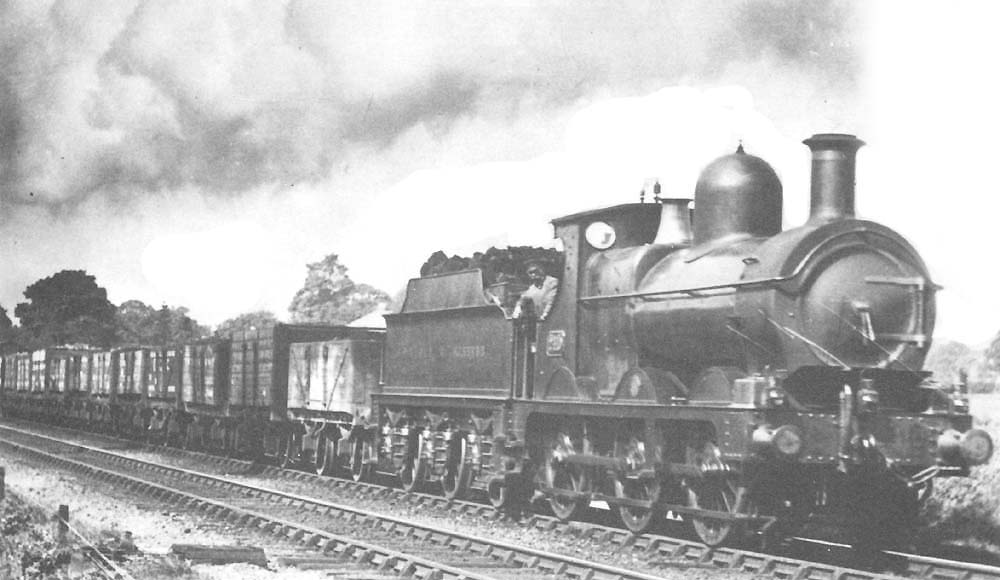 GWR 'Dean Goods' 0-6-0 No 2410 hurries past with an up freight service near to Knowle & Dorridge circa 1911
