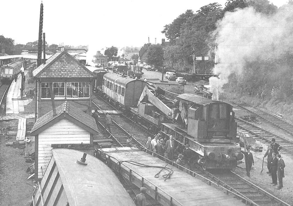 The Cowans Sheldon steam crane raises steam pressure in order to start recovery operations on 15th August 1963
