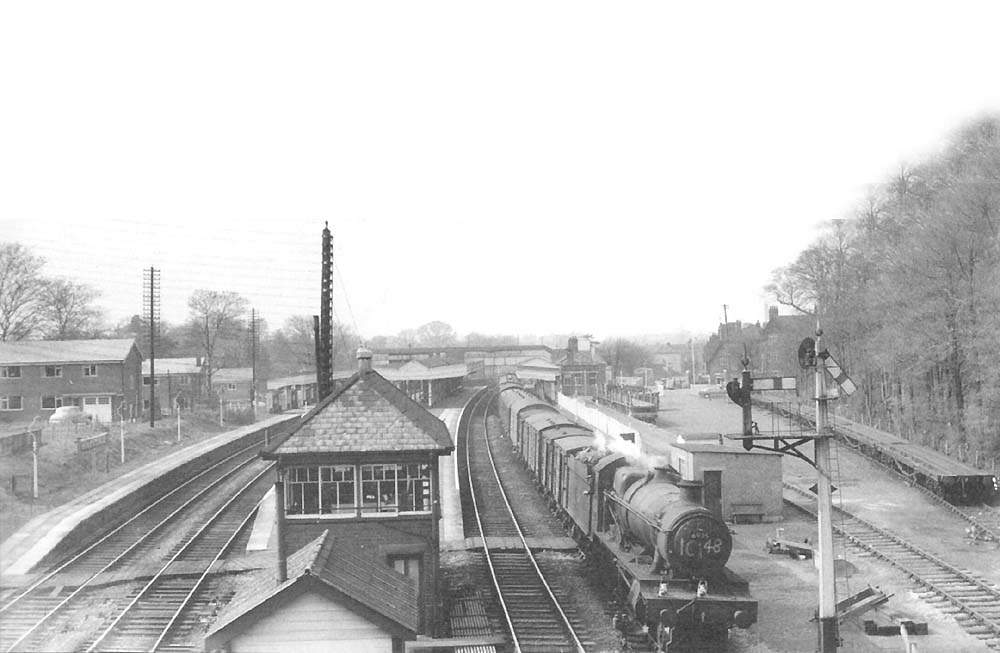 Ex-GWR 4-6-0 No 6925 'Hackness Hall' passes Knowle & Dorridge Signal Box on the up main line with a parcels train circa 1963-4
