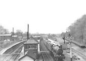Ex-GWR 4-6-0 No 6925 'Hackness Hall' passes the Signal Box on the up main line with a parcels train circa