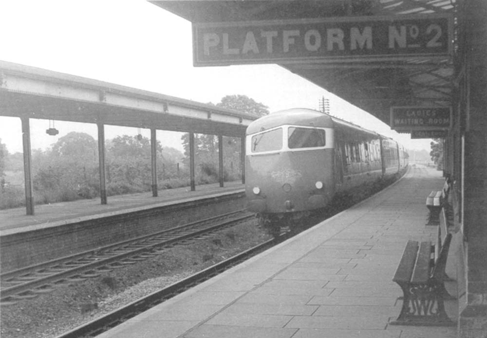 View of the Blue Pullmanas it passes through Lapworth station's up main platform at speed on a service from Paddington to Snow Hill