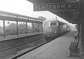 View of the Blue Pullmanas it passes through Lapworth station's up main platform at speed on a service from Paddington to Snow Hill