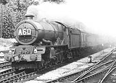Ex-GWR 4-6-0 King class No 6026 'King John' is seen passing the sidings at Lapworth whilst at the head of an up Paddington express on 25th August 1962