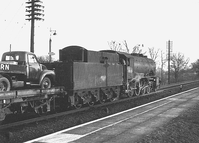 Ex-WD 2-8-0 No 90585 is seen reversing into the relief line to make way for the 4:30pm Wolverhampton to Paddington express service on 3rd March 1957