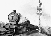 Ex-Great Western Railway 2-8-0 30xx class ROD No 3012 with a northbound class H unfitted through freight south of Lapworth on Sunday 4th December 1955