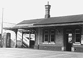 View from Station Road of the left hand side of Lapworth station showing its entrance and footbridge
