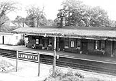 View of Platform 1 from the passenger footbridge showing the main station building and on the left the corrugated hut