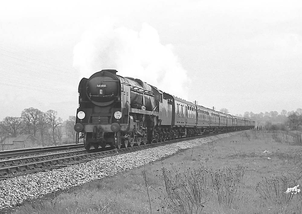 British Railways built Battle of Britain Class No 34088 '213 Squadron' heads through Lapworth on a football special on 27th April 1963