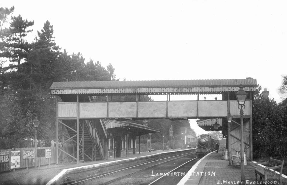 Looking towards Birmingham from the London end of the up platform as a local passenger train arrives at the station