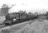 British Railways built 4-6-0 No 7014 'Caerhays Castle' heads a football special near Lapworth on 27th April 1963